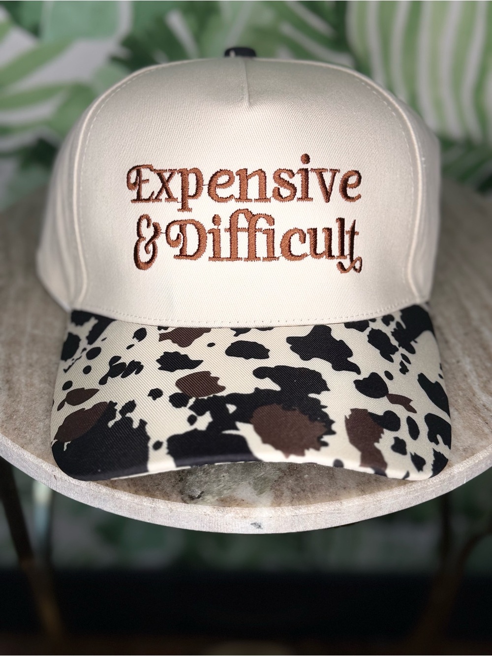 Cream Trucker Hat with Brown Text & Cow Print Brim